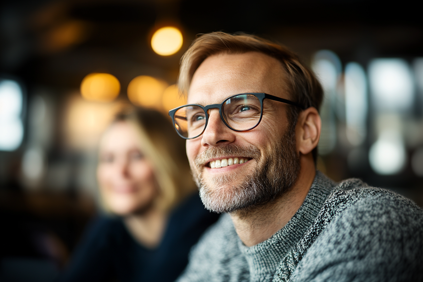 Explore partnerships with Insurte. Man with glasses in a friendly, modern office