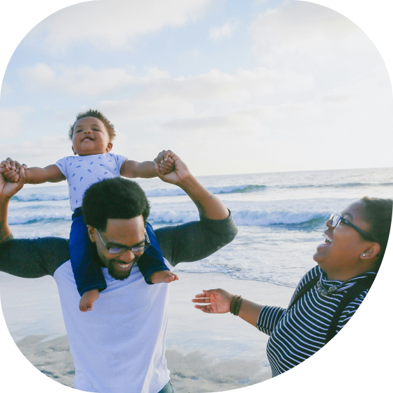 Happy tourists at the beach with AXA travel insurance